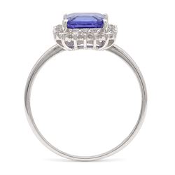 18ct white gold tanzanite and diamond cluster ring, single octagonal cut tanzanite of approx 0.80, surrounded by twenty-two round brilliant cut diamonds, stamped, total diamond weight approx 0.25 carat