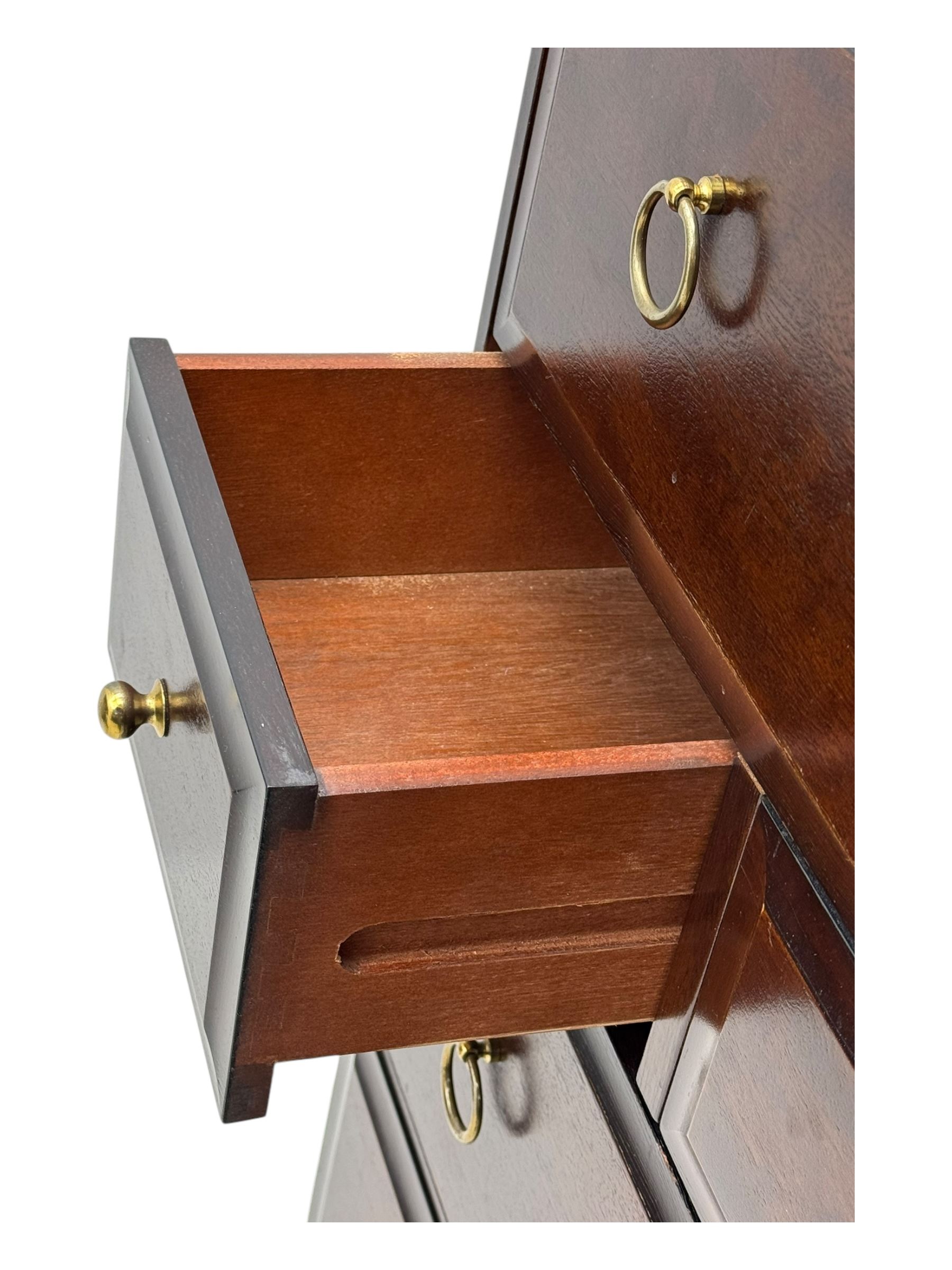 Stag Minstrel - mid-20th century chest, rectangular top over arrangement of three short and four long drawers, on bracket feet