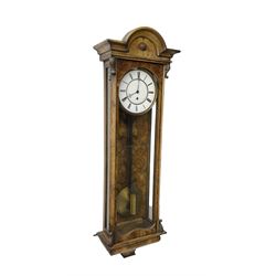 German - 19th century single train weight driven Vienna regulator in a figured walnut case, with a break arch top and ogee base, fully glazed door with canted corners and carving, two part enamel dial with Roman numerals and pierced steel hands, timepiece weight driven movement with a brass faced pendulum bob. 