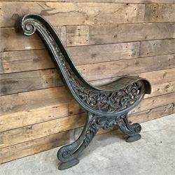 Early 20th century heavy cast iron three piece bench ends, decorated with scrolls and floral swags