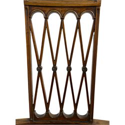 Edwardian Sheraton revival rosewood elbow chair, moulded cresting rail over frieze panel inlaid with scrolling foliate, fan carved corner brackets over an overlapping lattice splat, swept and moulded arms with scroll and acanthus carved terminals, curved supports with foliate carved capitals, the seat upholstered in leather with studwork band, square tapering supports with spade feet inlaid with boxwood stringing and trailing bell flower motifs

This item has been registered for sale under Section 10 of the APHA Ivory Act 