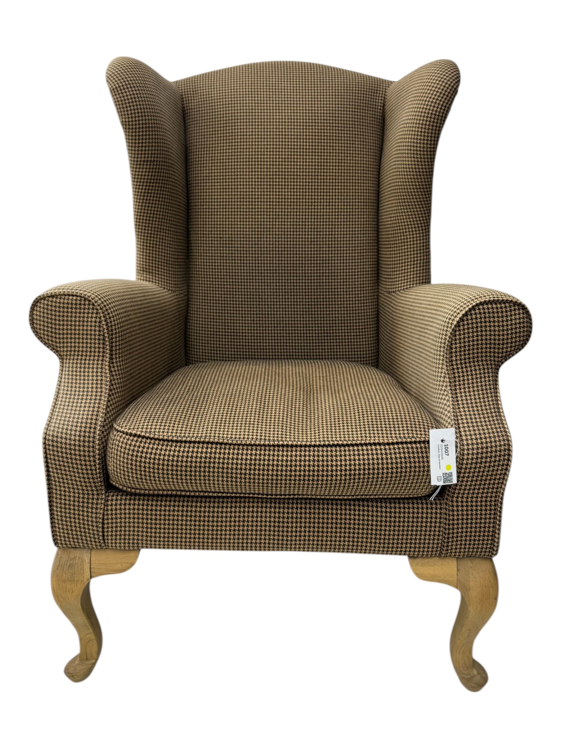 Hardwood-framed wingback armchair, upholstered in dog tooth pattern fabric, on cabriole supports 
