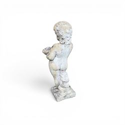 Early composition stone figure of a boy with grape basket, original flakey white paint