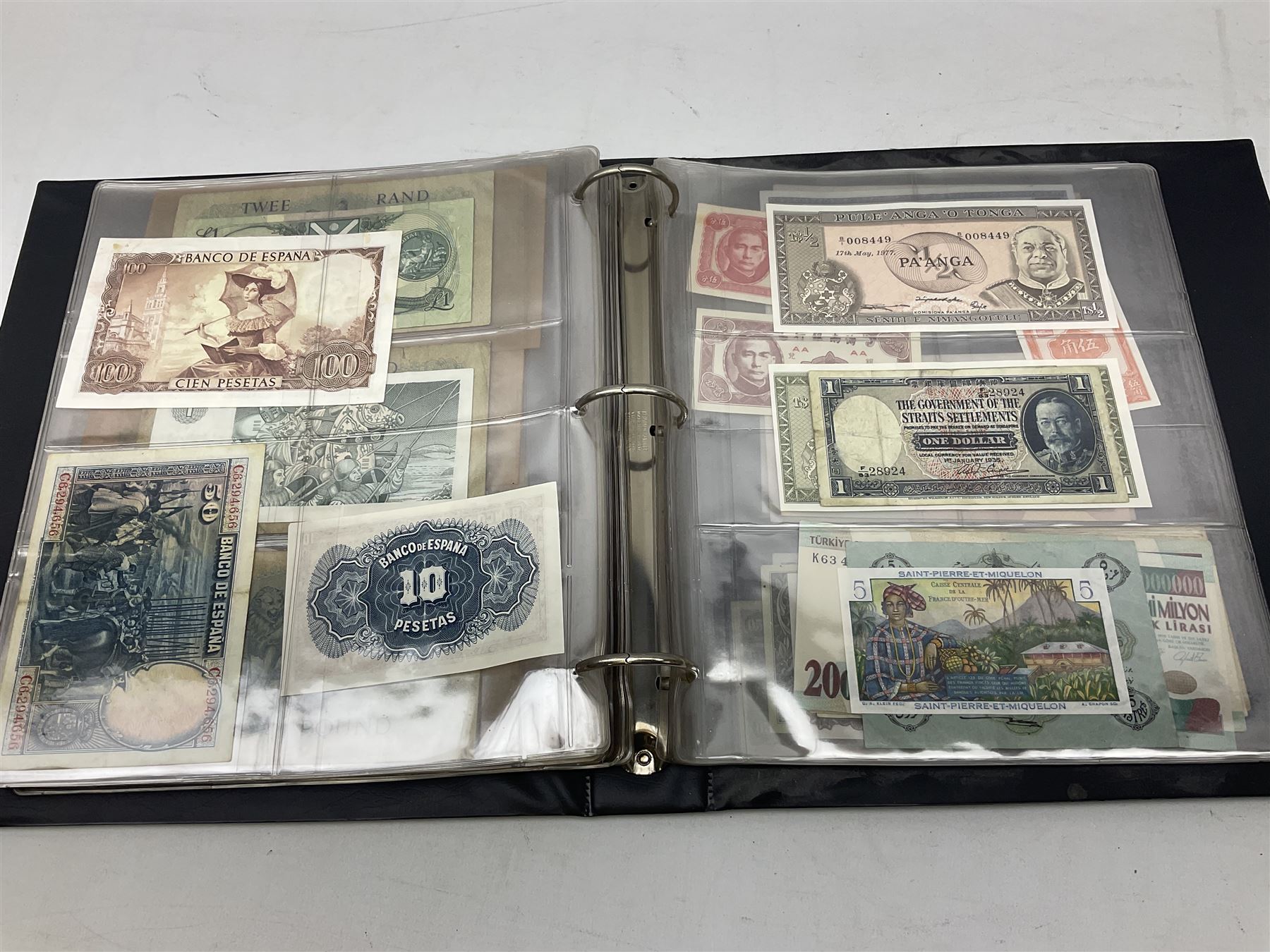 World banknotes, including Queen Elizabeth II The States of Jersey one pound 'DB202703', five pounds 'BB527762' and ten pounds 'AB651481', reserve bank of New Zealand two dollars '1L3 741894', King George V Straits Settlements one dollar 1st January 1935 'F/83 28924', various Bank of England notes etc, housed in two ring binder albums