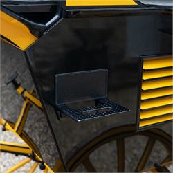 Roof Seat Break by Shanks of London

A roof seat break by Shanks of London built on a perch in black and yellow livery, the body fitted with an elevated driver's box seat, elevated rear groom's seat and central passenger compartment. The carriage is mounted on wooden spoked wheels with leaf spring suspension and is equipped with louvred underbody storage compartments, carriage lamp brackets (lamps next lot), folding access steps and a pole for driving with a pair or team of horses. The wheel hubs are stamped 