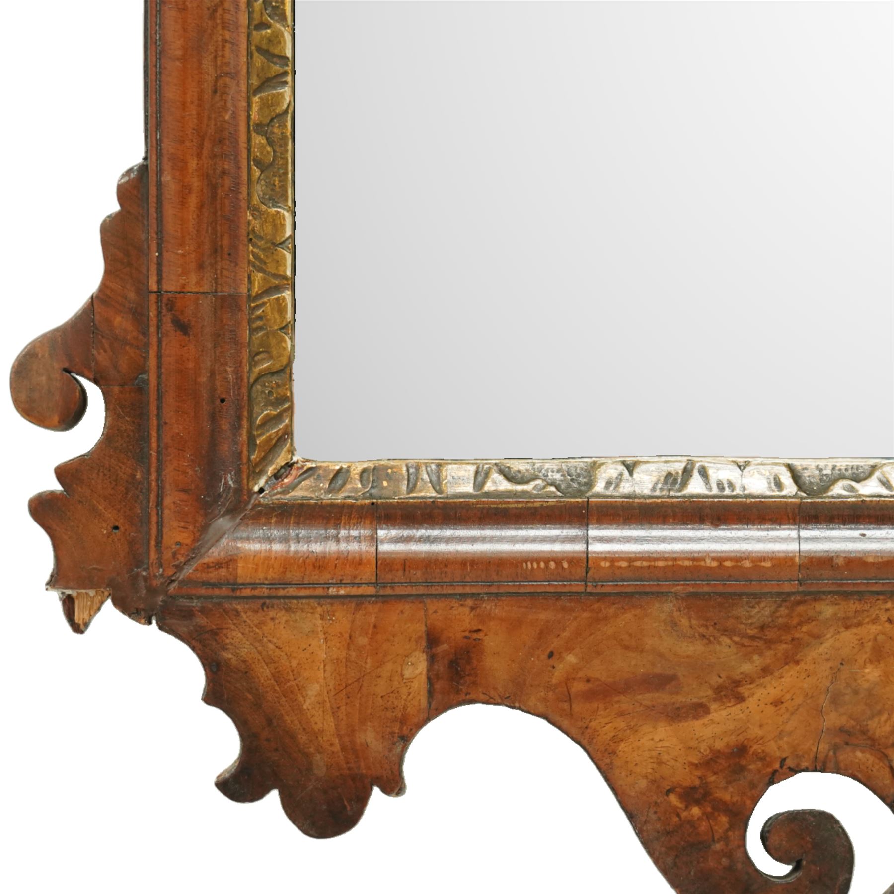 18th century Chippendale design walnut wall mirror, shaped and scroll carved cresting with central gilt acanthus roundel, moulded frame with inner gilt slip, shaped apron and scroll carved corners