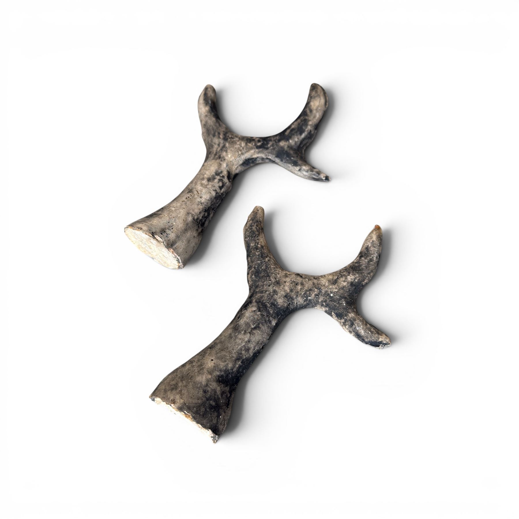 Pair of cast stone garden deer in a weathered finish with two loose antlers