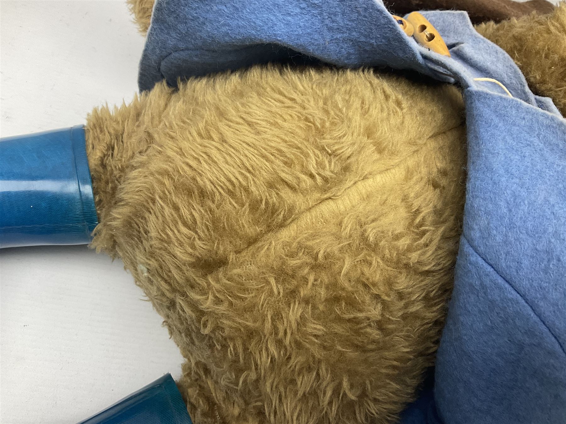 Paddington Bear with plush covered body, brown felt hat, pale blue duffle coat and blue wellingtons H54cm
