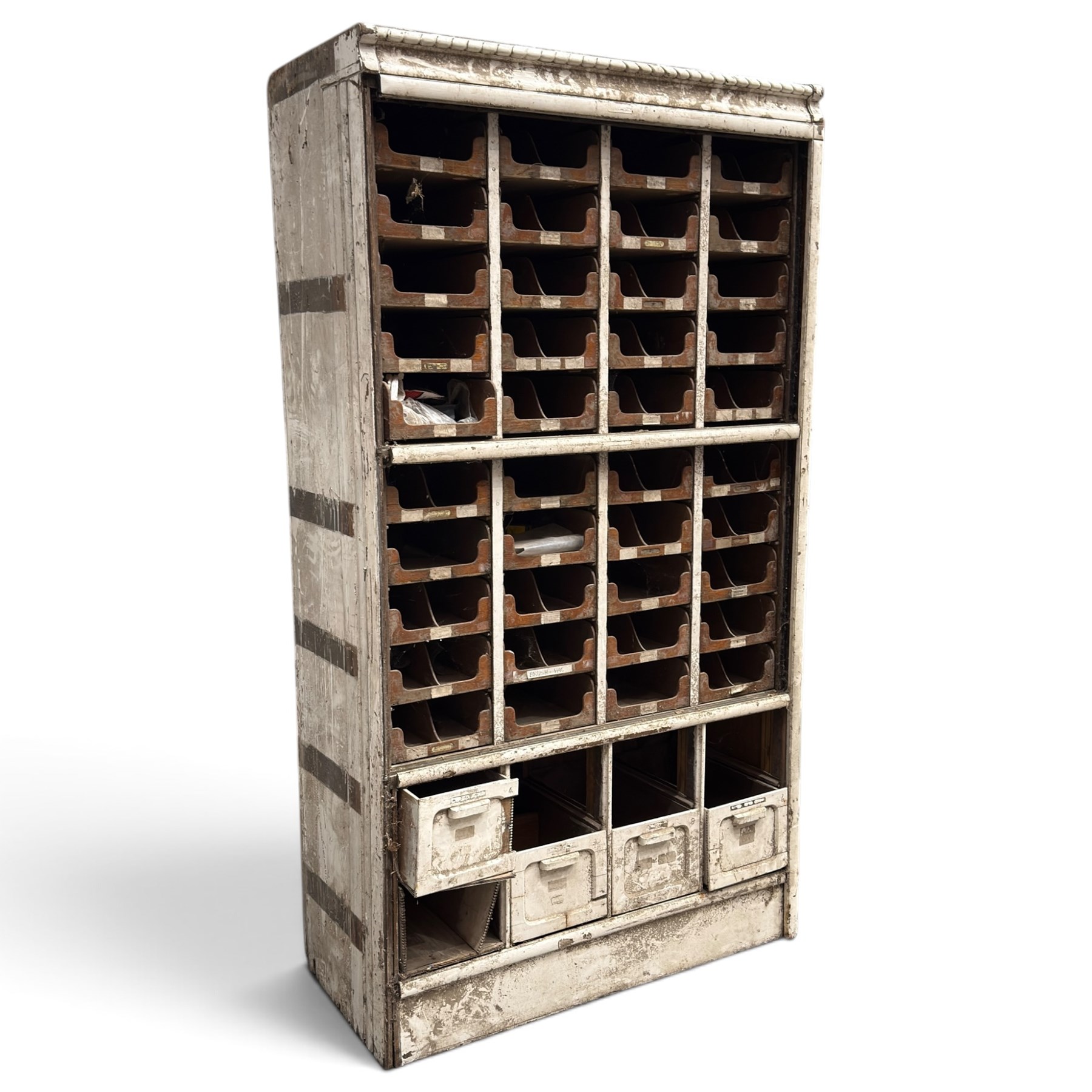 F Pollard & Co - late 19th century rustic haberdashery shop cabinet, fitted with an assortment of forty sliding trays, with drawers fitted to base, in antique white-painted finish