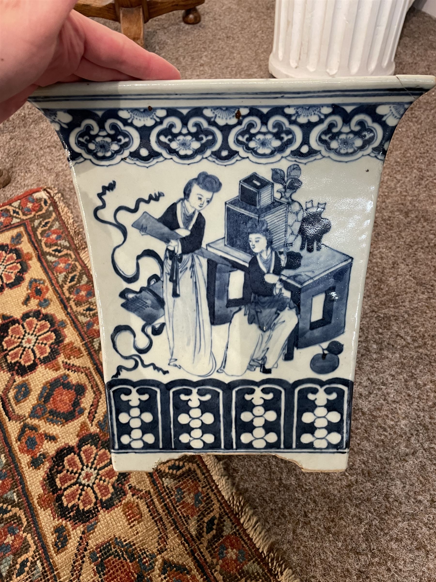 19th century Chinese blue and white planter and stand, each of square slightly tapering and flared form, the planter decorated with figures and precious objects between stylised foliate borders, the stand decorated with landscapes beneath a lipped rim with cell band, planter H28cm D25.5cm, stand H7cm D26cm