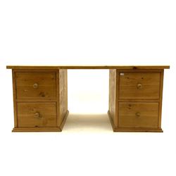 Large solid pine twin pedestal desk, each pedestal fitted with two deep drawers, moulded plinth base 