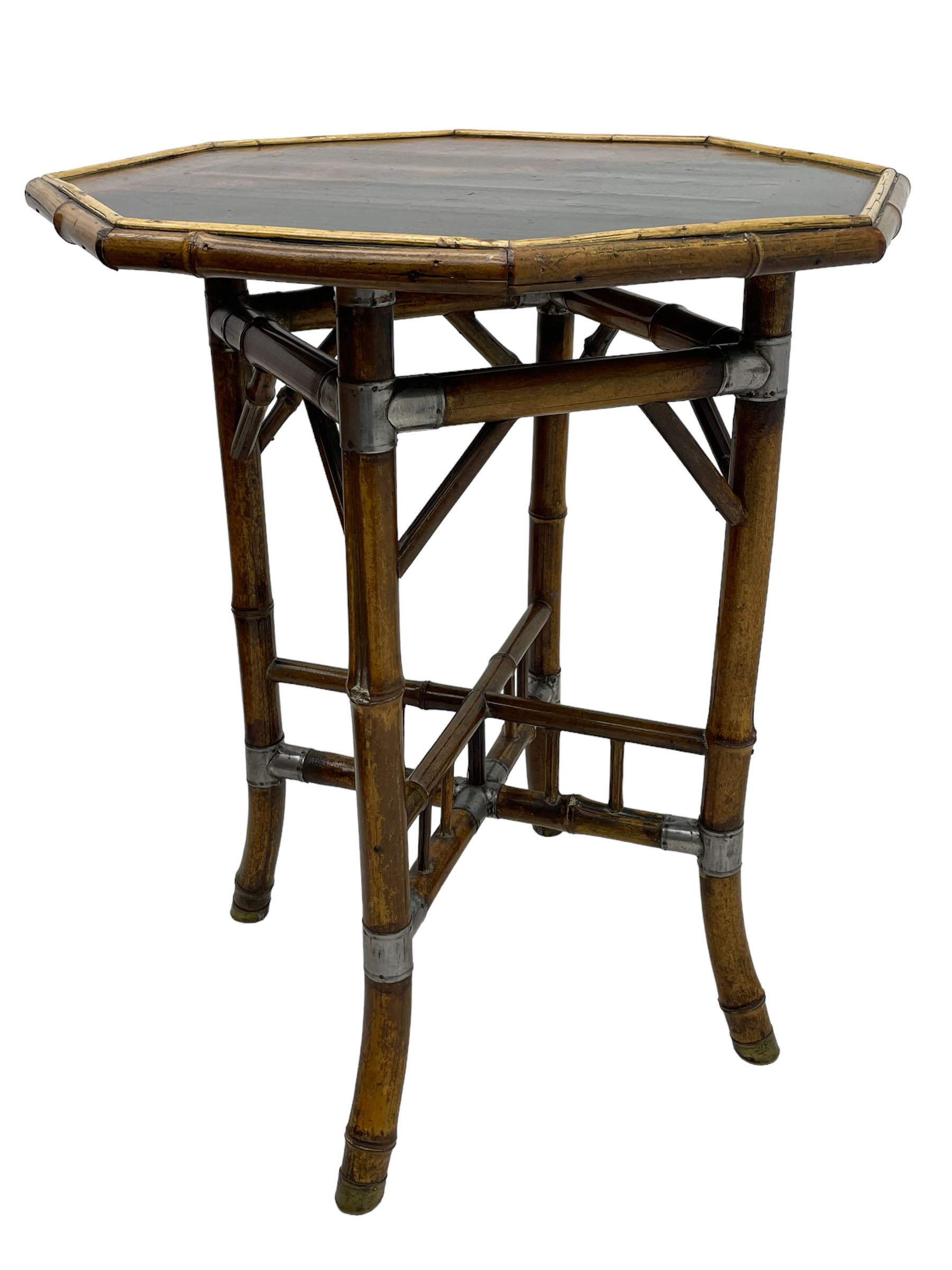 W.F. Needham - Victorian bamboo occasional table, octagonal lacquered top, the bamboo joined by metal brackets, brass cups stamped 'W.F Needham'