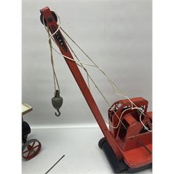 Mamod TE1a steam traction engine with burner, bunker, steering rod and funnel; red and black painted Tri-ang tin-plate Jones KL44 mobile crane; and two Hull Savings Bank Home Safe money boxes; all unboxed (4)