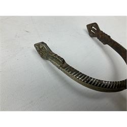Pair of late 19th century South American iron spurs, engraved silver mounts, with sunburst rowls
