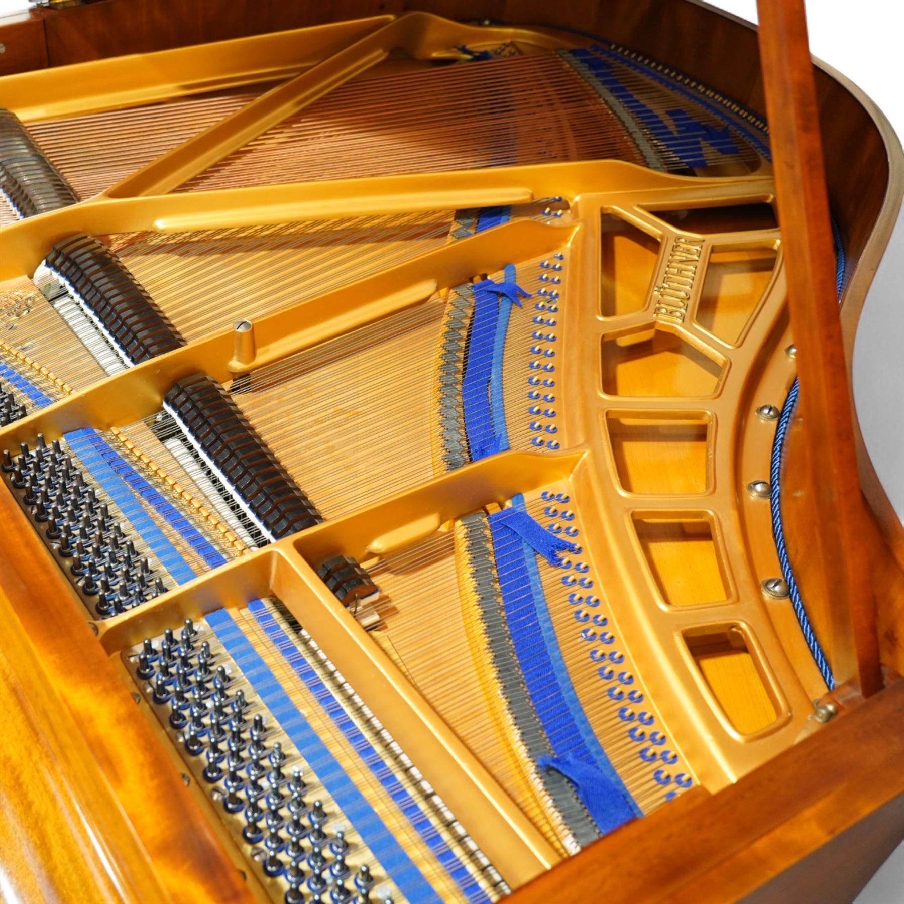 Julius Bluthner-light mahogany overstrung Baby Grand Piano serial No 118183 (1934), with a grand roller action, 88 ivory and ebony keys AO-C7, raised on three square tapered legs with brass castors, adjustable music desk and Lyre with sustain and una-corda pedals, recently (2007) thoroughly restored, case re-finished and polished, action completely overhauled and adjusted with good repetition, frame totally re-strung including copper wound bass strings, new tuning pins, hammer heads, dampers and traditional blue Bluthner string felt, in very good playing condition. With a matching adjustable piano stool fitted with a leather cover. Tuned to concert pitch, A=440.  Complete with key fall lock and key and three castor cups.
This item has been registered for sale under section 10 of the APHA Ivory Act, Reference X76CPCS8