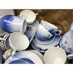  Bing & Grondahl, Copenhagen blue and white Christmas Rose pattern tea wares, to include teapot, covered sucrier, milk jug, fourteen cups and seventeen saucers, etc, together with two Royal Copenhagen collectors plates etc  