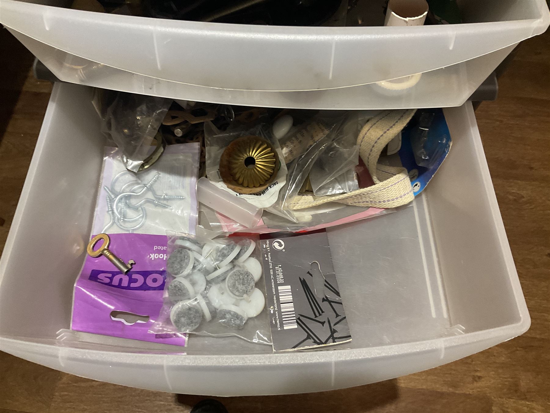 Large quantity of light fitting spare parts and accessories in plastic floor standing six-drawer chest