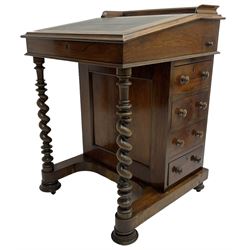 Victorian walnut Davenport, hinged sloping top with inset leather writing surface, enclosing satinwood lined interior with two drawers over faux drawer, fitted with inkwell drawer and pen compartment to the side over four drawers with an opposing false set, raised on spiral turned supports united by a shaped platform base