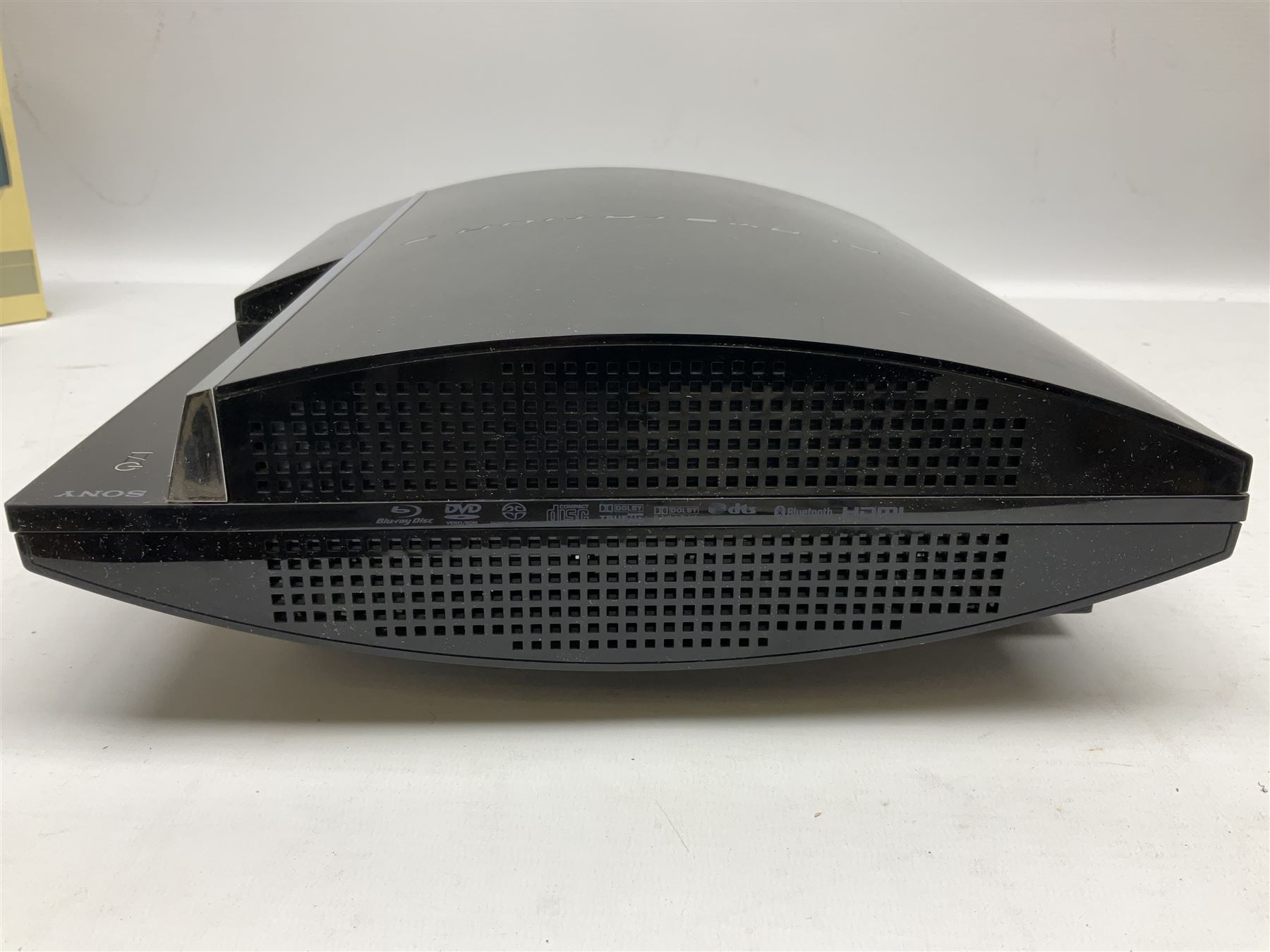 Sony PlayStation 3 60GB console with one PS3 controller, two PS2 controllers, BD remote control, PSP handheld gaming console with case, GAMEware PSP essentials pack, and a selection of PS2, PS3 and PSP games in original cases with instruction booklets 