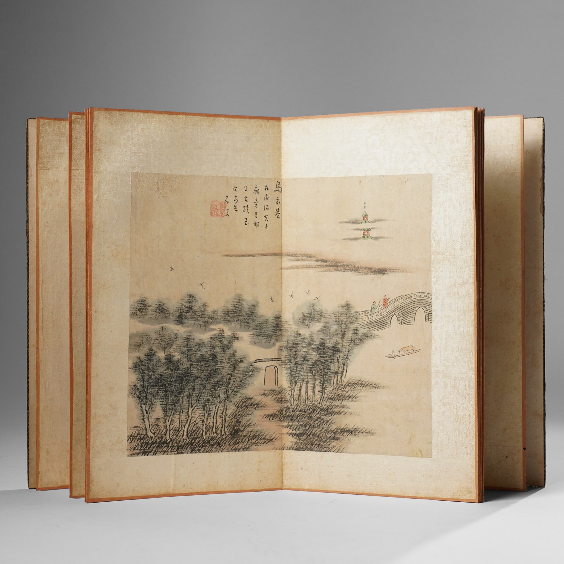 Chinese fold out book, comprising 12 hand-coloured woodblock landscapes each bearing inscription and artists seal  