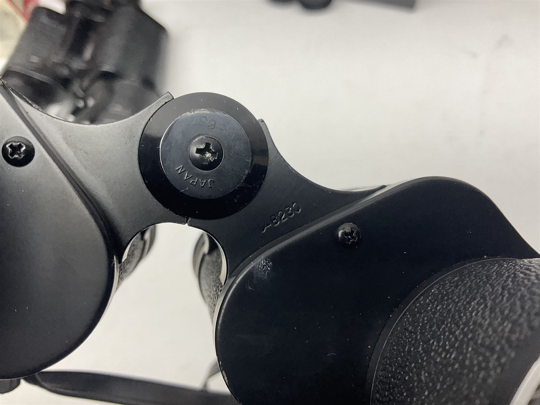 Pair of French binoculars by A.Tubeue Paris, together with three other pairs of binoculars including Telemax 5, Tasco Zip and Hanimax examples and a Panavue automatic slider viewer