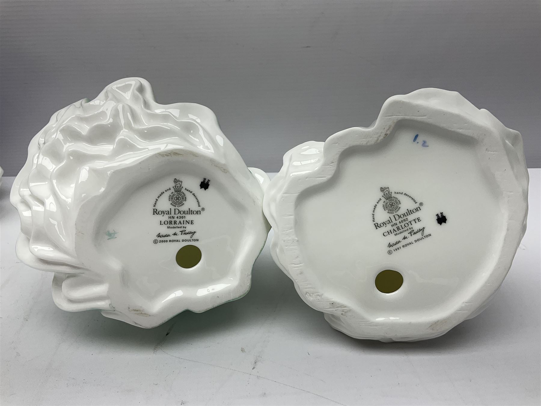 Seven Royal Doulton figures, comprising Sara HN2265, Lorraine HN4301, Mary HN3375, Olivia HN5114, Charlotte HN4092, Josephine HN4223 and Rachel HN4780, together with five smaller Royal Doulton figures (12)