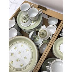 Quantity of Denby Verona pattern tea and dinner wares, decorated with floral sprays and within green borders, to include lidded twin handled bowls, teacups and saucers, dinner plates etc in two boxes