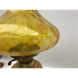 Copper and brass oil lamp with a corinthian column  chimney and yellow glass shade, together with five other similar examples