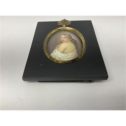 Continental School (19th century)
Portrait miniature upon enamel
Head and shoulder portrait of a young woman draped in a white robe, in the style of KPM and Vienna
Within a gilt metal mount and rectangular ebonised frame with acorn and oak leaf mounted suspension ring
Oval 6cm x 4.5cm
Frame 11cm x 9cm