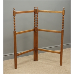  Early 20th century oak folding towel rail, W107cm, H103cm, (maximum measurements)  