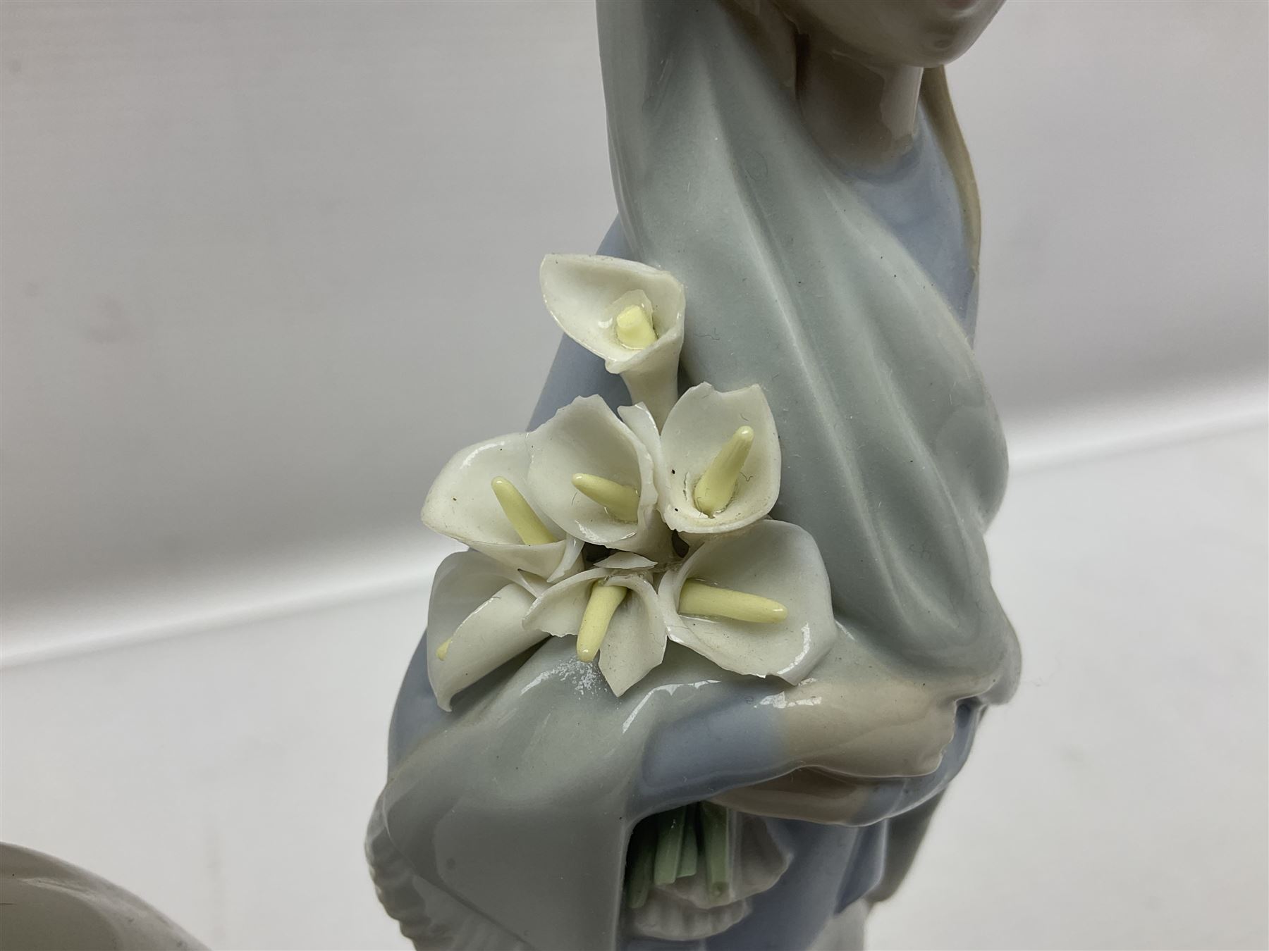 Four Lladro figures, including Girl With Cockerel no 4591, Gres Lonely no 2076 etc together with Nao figure 