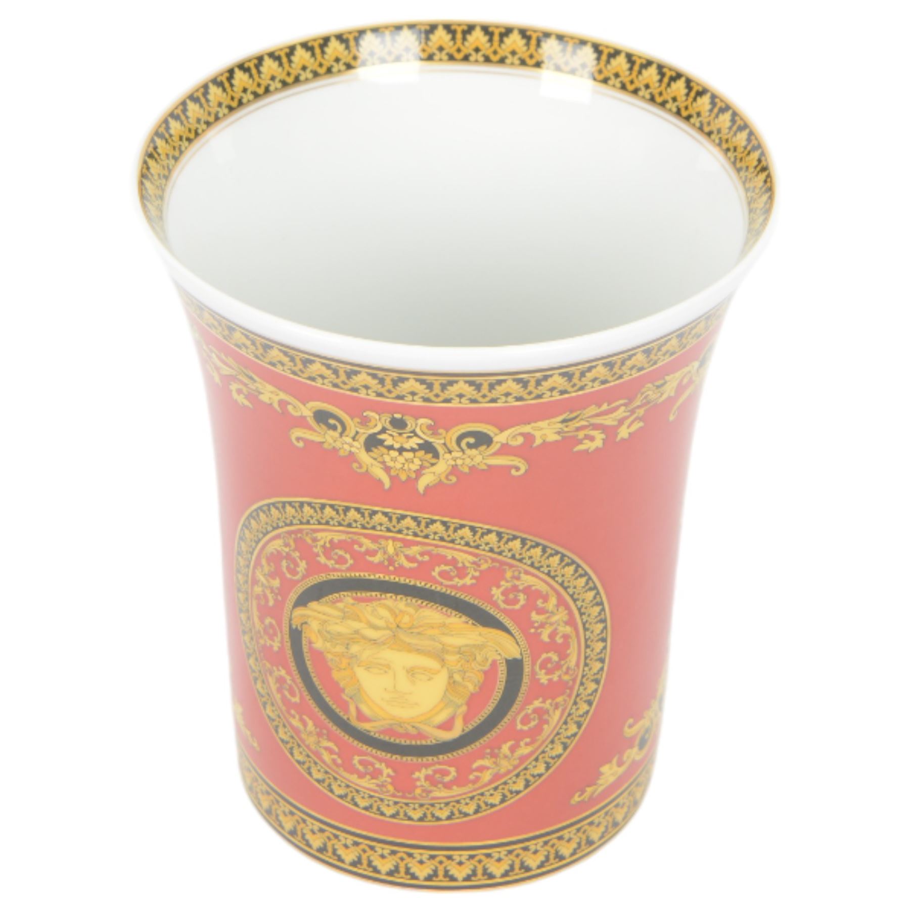 Rosenthal Medusa Versace vase, featuring a gold-shaded Medusa head surrounded by baroque details upon a red ground, H18cm 