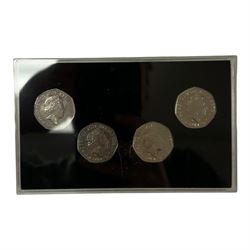 Mostly commemorative coins, medallions and fantasy coinage, including various 'Sainsbury's Makers of the Millennium' medal collection folders containing various medallions, The Toer Mint commemorative four medallion set in fitted case, Queen Elizabeth II 1982 silver proof piedfort twenty pence coin cased with certificate, various part filled The London Mint office folders etc