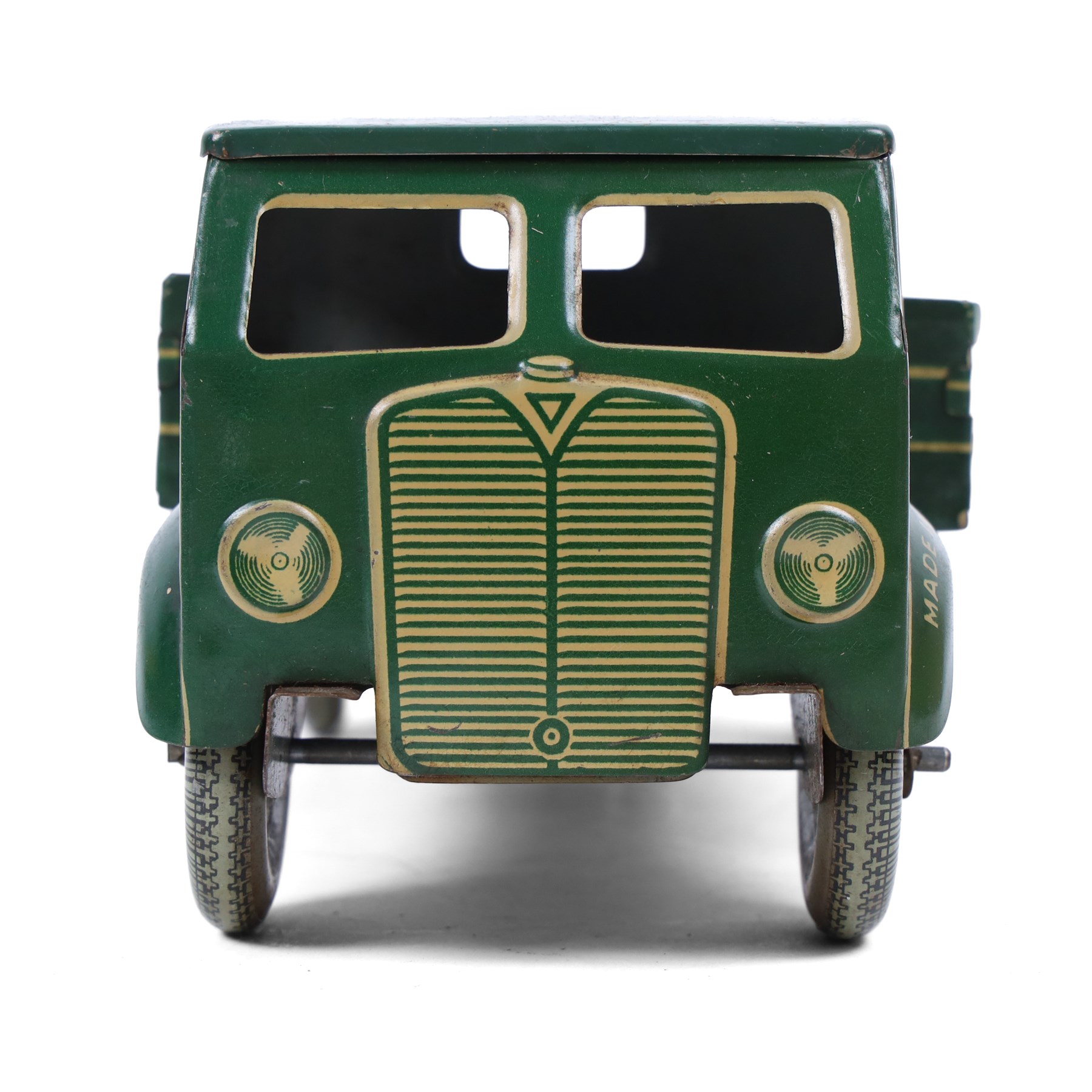 Mettoy tin plate clockwork Dunlop 90 tipper truck, in green and cream livery, H10cm, L28cm