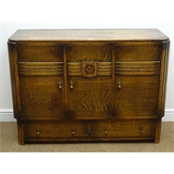  Early 20th century medium oak sideboard, three cupboard doors, carved rose detail, two long drawers, reeded supports, W122cm, H87cm D47cm  