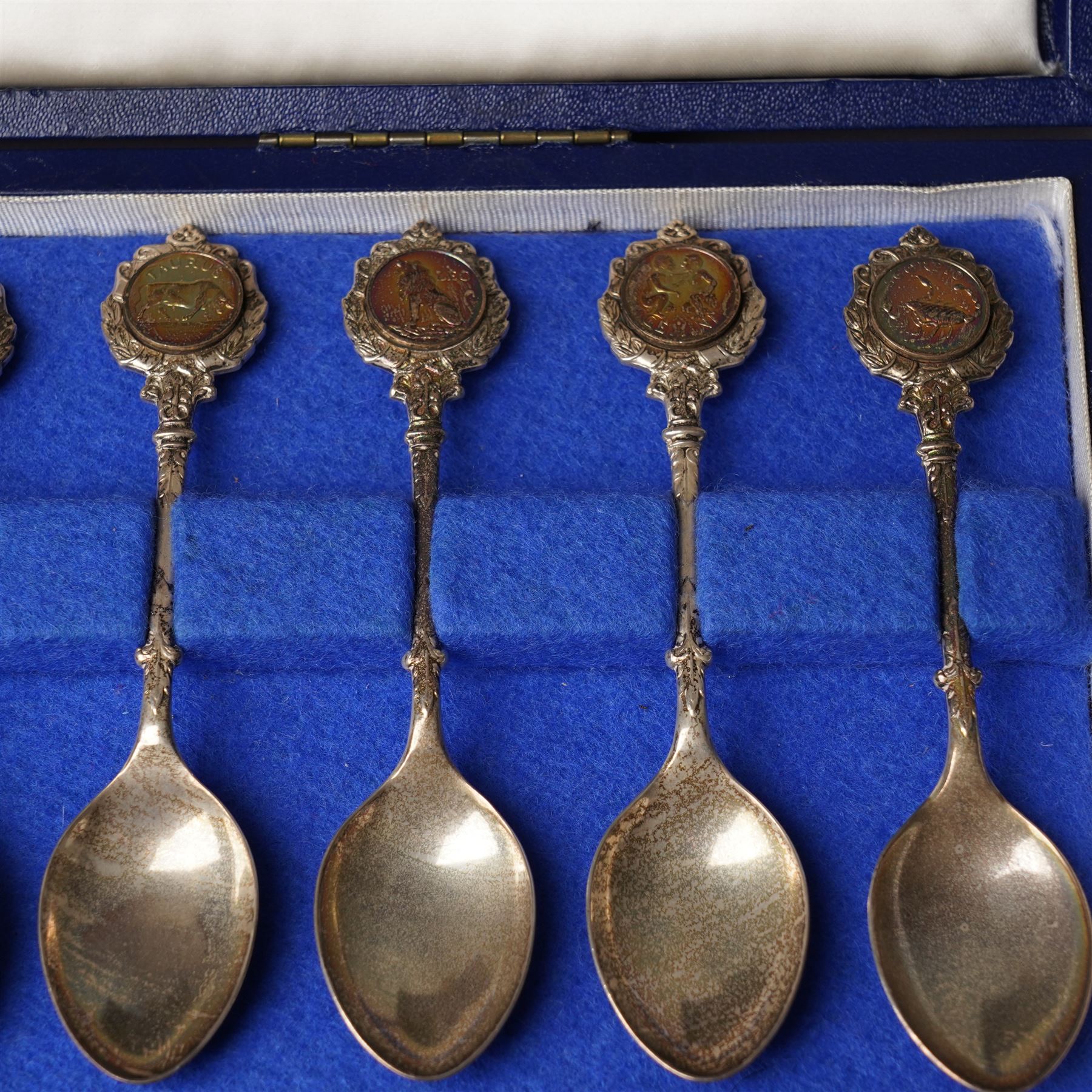Set of twelve silver teaspoons 'The Twelve Zodiac Spoons' all with symbols of the Zodiac and in fitted case London 1971 Maker John Pinches