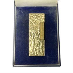 Dunhill gold plated lighter with textured bark effect decoration, in fitted case