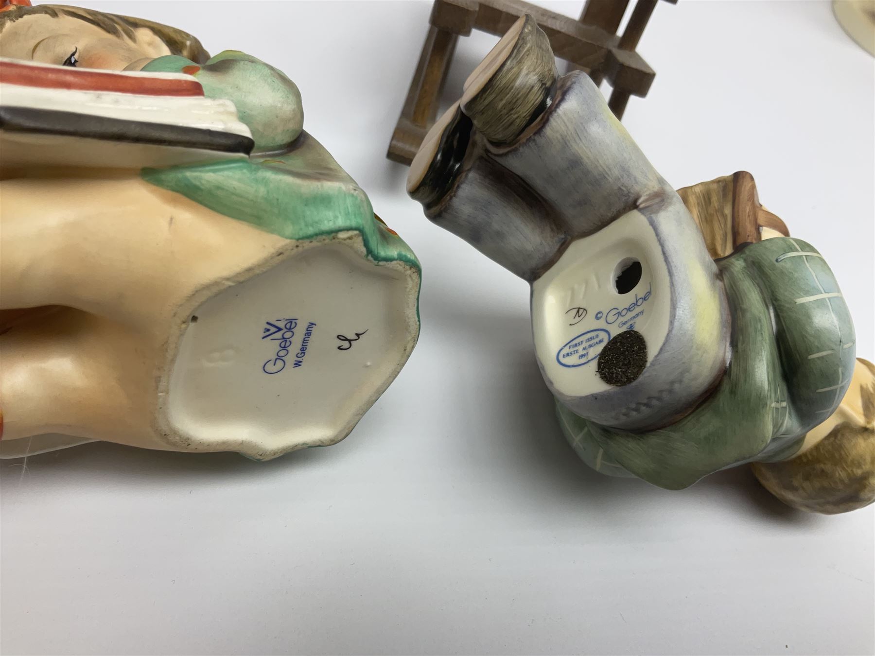 Twenty five Hummel figures by Goebel, to include Tuning up, Blessed Event, Book Worm, The Little Architect etc 