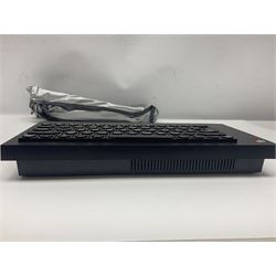 Sinclair ZX Spectrum (1984) with accessories and games; ten games for Sinclair Spectrum and 48K Spectrum to include ‘Knight Lore’, ‘The Way of the Exploding Fist’, and ‘Green Beret’ all in original boxes, ‘Rambo First Blood Part II’ without original box; Sinclair UK1400 Power Supply Unit, Hales Universal Mains Adapter, RAM Turbo Spectrum Joystick Interface, Starlite Cassette Player, all without boxes