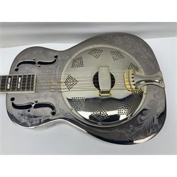 Ozark metal cased resonator guitar with all over chased foliate decoration to the polished finish and mother-of-pearl inlay to the fretboard L100cm; in Stagg hard carrying case