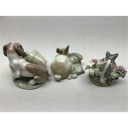 Three Lladro figures, comprising Kitty Confrontation no 1442, It Wasn't Me no 7672 and Rabbit Eating no 4772, all with original boxes, largest example H10cm