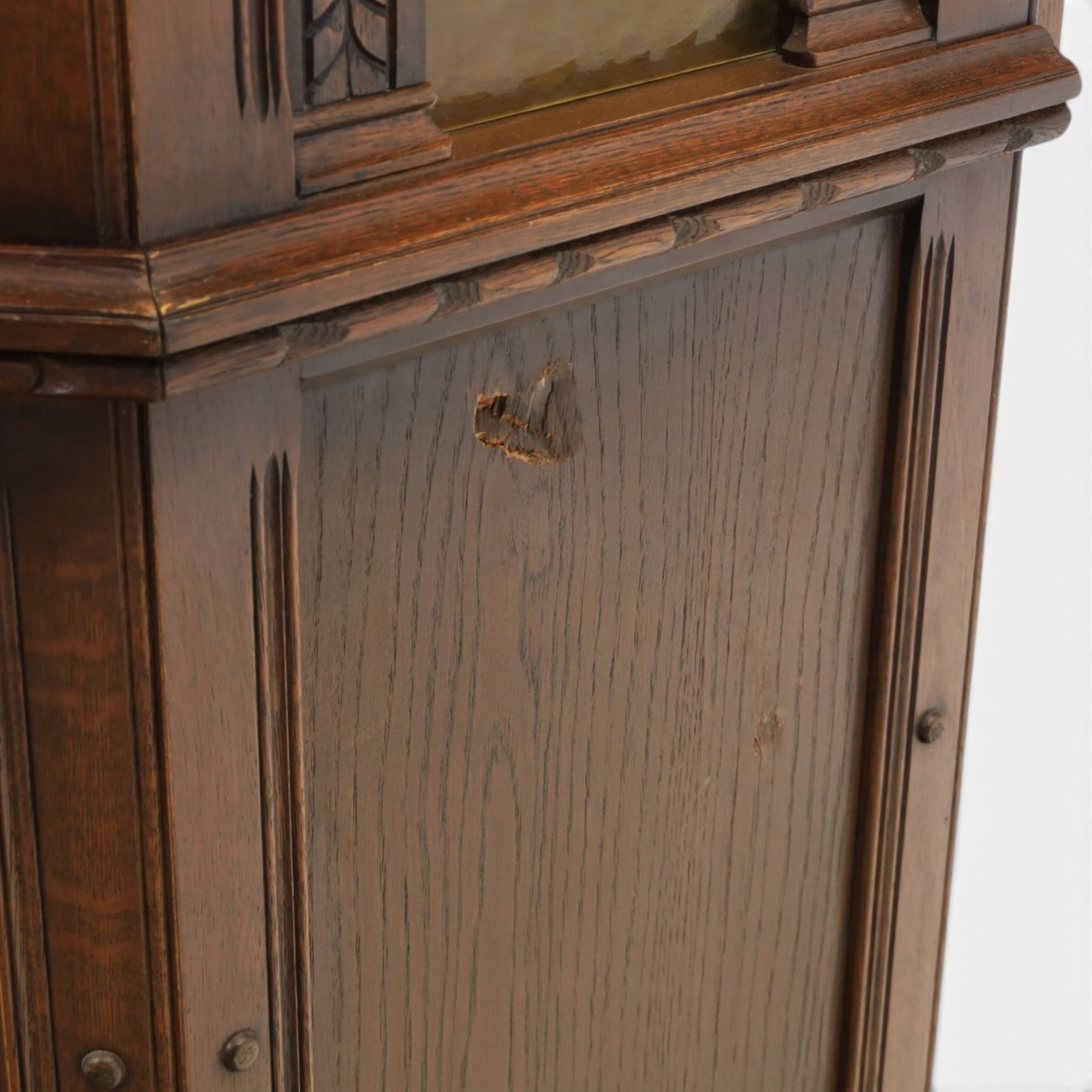 Old Charm - carved oak bar with three bar stools and associated Old Charm drinks cabinet, carved top with channels for glassware beneath, bar surface above glazed panels, shelves for glassware to the back, associated Old Charm drinks cabinet with fall front linenfold carving, above twin doors with shelved interior