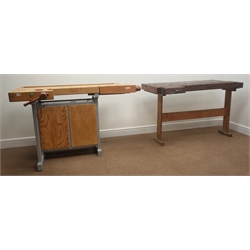 Two timber workshop work benches, fitted with vices and a storage cupboard (W120cm, H75cm, D50cm and W120cm, H80cm, D44cm)  