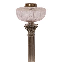 Victorian silver plated Corinthian column oil lamp, raised upon a stepped base, clear glass reservoir, H54cm 