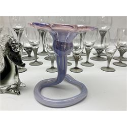 Murano glass figure of a recumbent horse, Murano Lavorazione purple and pink flower, and quantity of matching drinking glasses