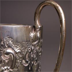 Edwardian silver twin-handled trophy, with embossed floral and scrolling decoration, upon a knopped stem and circular foot, hallmarked Goldsmiths & Silversmiths Co Ltd, London 1903, upon a black plinth, including plinth and handles H32cm