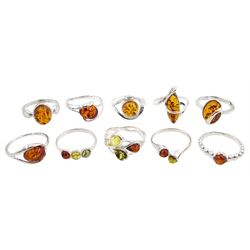 Ten silver amber rings, all stamped 925