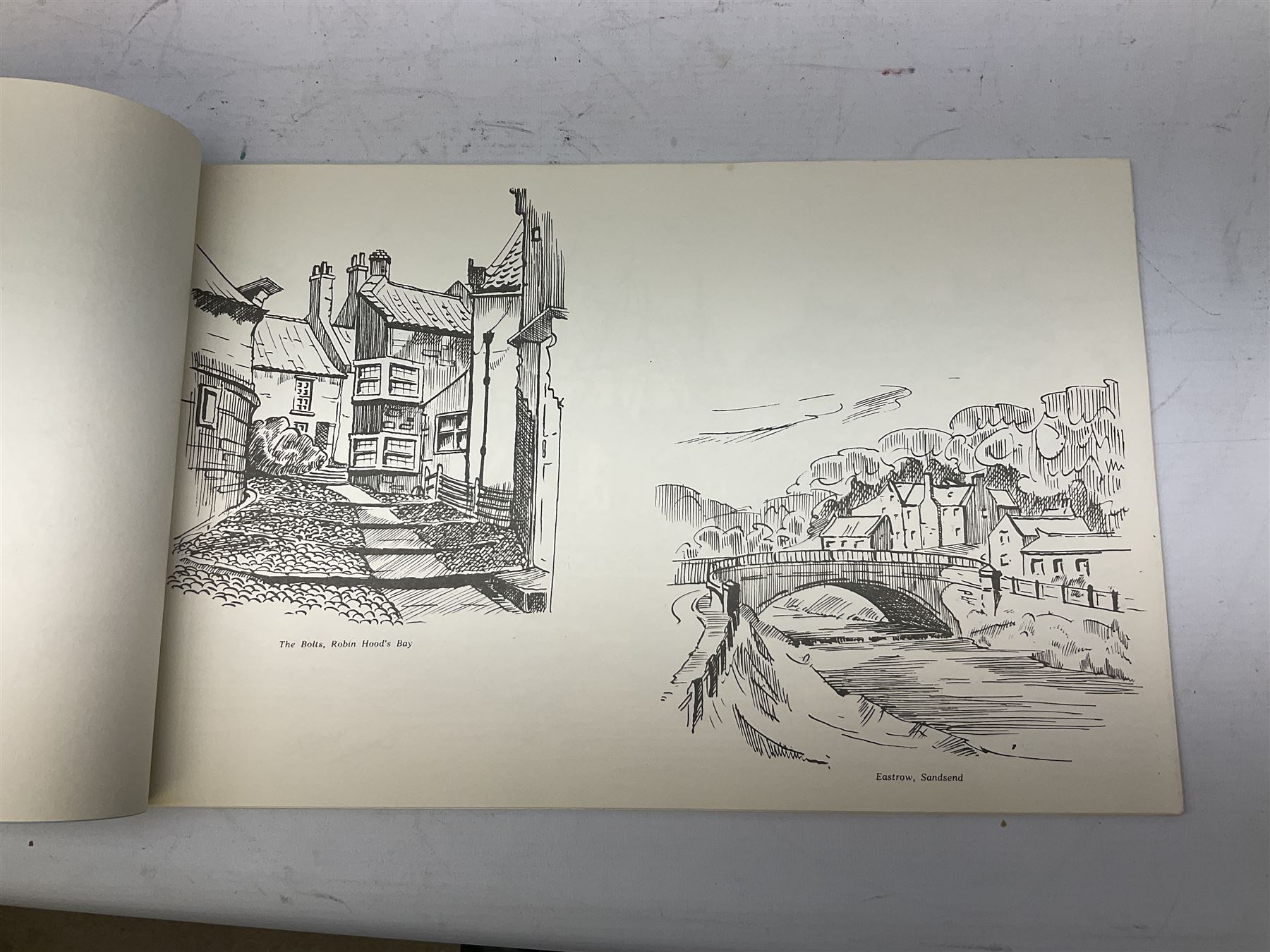 Quantity of books and postcards predominantly of Whitby interest including Hornes' Guide to Whitby 1890 and Hornes' Tourist map of Whitby, A Holiday Tour in and Around Whitby by H.S. Forman 1896 etc