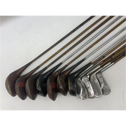 Approximately twenty-three golf clubs, to include early 20th century examples, Spalding Bruce Devlin Gold Line Ply Power and Kro-Flite wood examples, mallet head examples, putters etc, together with carry case