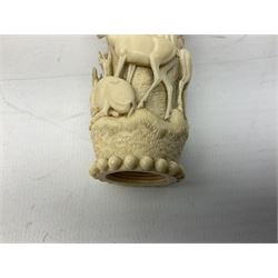 19th century carved ivory walking cane or parasol handle, of tapering form with screw thread interior, the sides carved in relief with deer upon rocky ledges, the top carved with oak leaves, H10.5cm